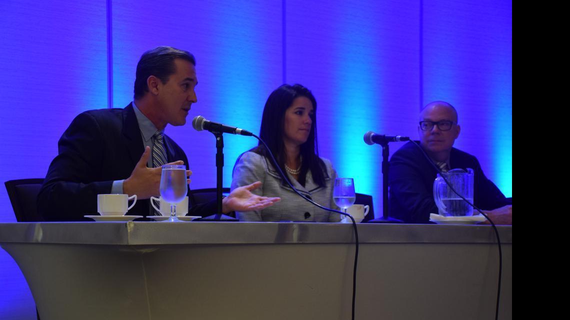
Senators Rene Garcia, R-Miami (left), Anitere Flores, R-Miami (center), and Rep. David Richardson, D-Miami Beach (right), talk about Medicaid expansion's role in Florida's upcoming special legislative session during Wednesday's Gap Coverage educational forum held by the Health Foundation of South Florida. 
