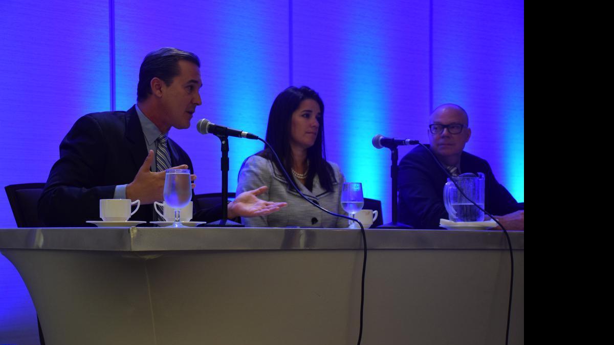 
Senators Rene Garcia, R-Miami (left), Anitere Flores, R-Miami (center), and Rep. David Richardson, D-Miami Beach (right), talk about Medicaid expansion's role in Florida's upcoming special legislative session during Wednesday's Gap Coverage educational forum held by the Health Foundation of South Florida. 
