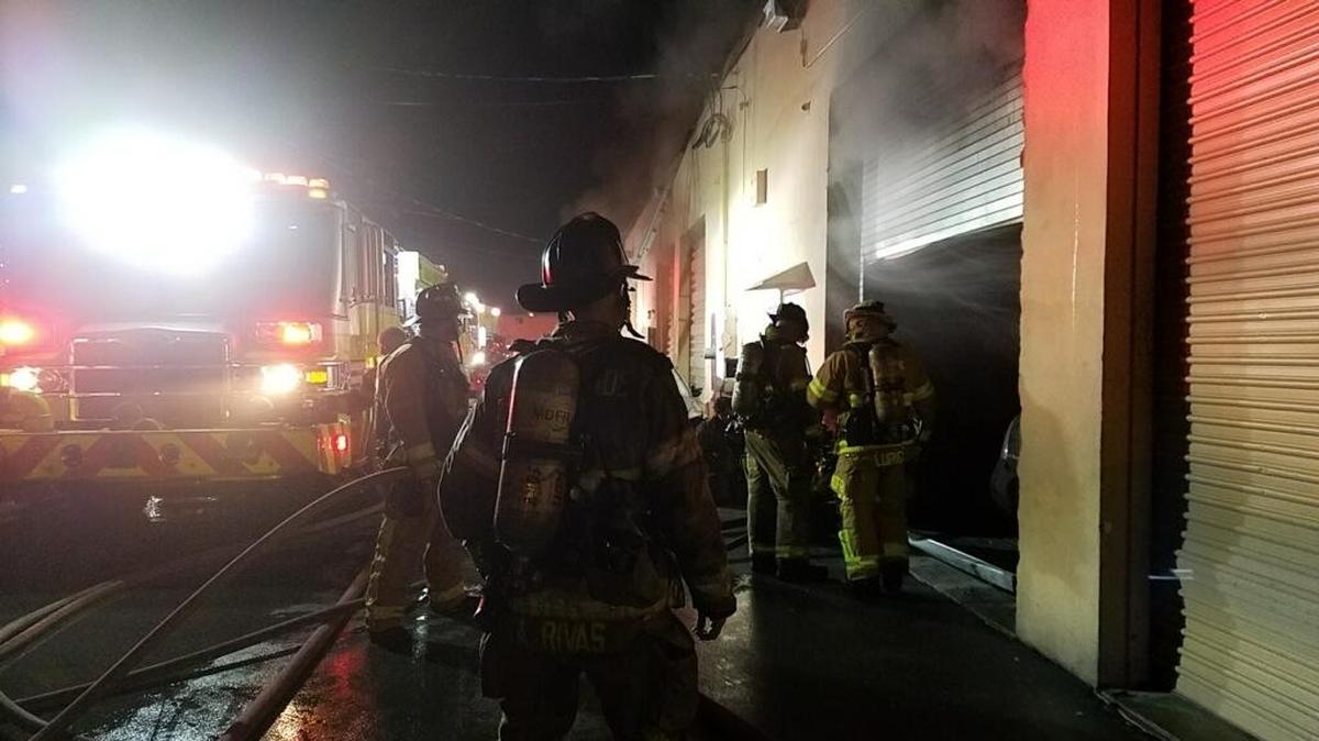 Firefighters work a warehouse blaze early Wednesday in Brownsville.