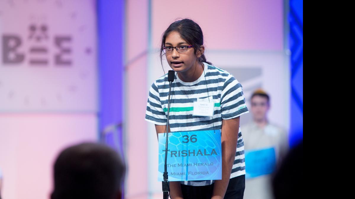 
Trishala Kumar, 13, an eighth grader at American Heritage School in Plantation, correctly spells “klompen’’ to pass round two — one of the preliminary rounds — of the 2015 Scripps National Spelling Bee being held at the Gaylord National Resort and Conference Center in National Harbor, Md. on May 27, 2015.
