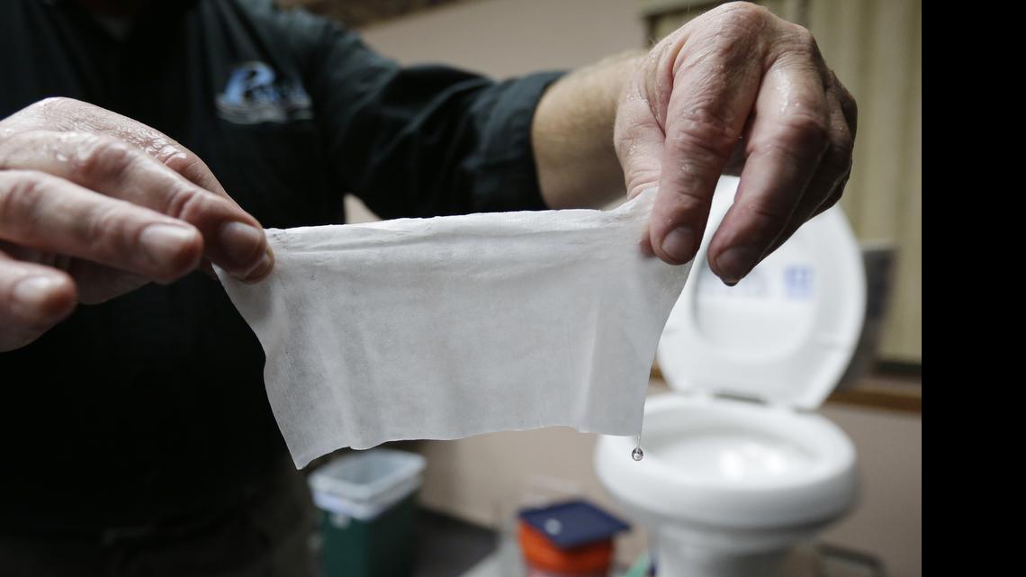 
In this photograph taken, Friday, Sept. 20, 2013, in Middlesex, N.J., Rob Villee, executive director of the Plainfield Area Regional Sewer Authority in New Jersey, holds up a wipe he flushed through his test toilet in his office. Miami-Dade County’s sewer department launched a campaign Tuesday against “flushable wipes,” joining a national effort to keep the popular products out of the toilet. 


