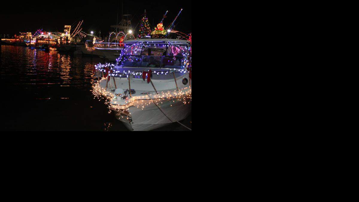 
Decorated boats are parked outside of the Miami Outboard Club near the MacArthur Causeway in Miami Beach during last year’s annual parade and toy drive.
