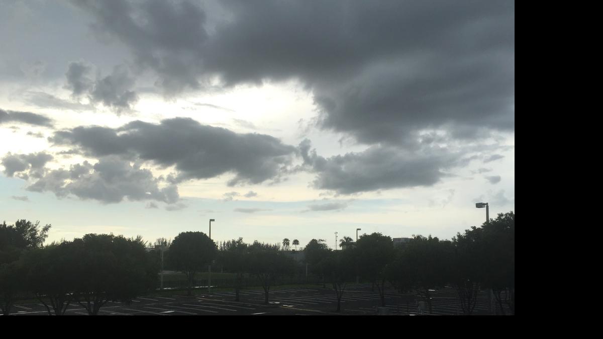 
Dark clouds linger in the skies over Doral after rains on Sunday, June 28, 2015.
