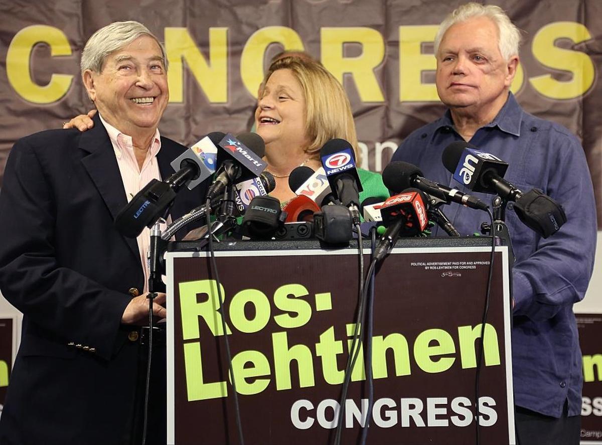 U.S. Rep. Ileana Ros-Lehtinen, center, reminds Holocaust survivor David Mermelstein, left, that her remaining days in Congress will be to fight for compensation for Holocaust survivors.
