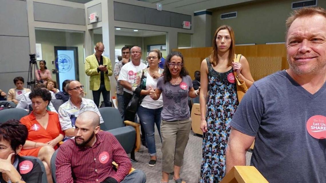 Airbnb supporters line up to speak to city of Miami commissioners.