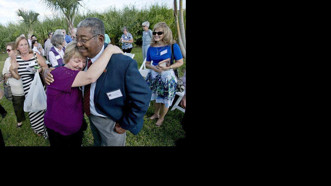 
Ruth Reynard, art left, gets a hug from by Juan Tamayo on Sunday November 16, 2014 outside the Vista Lago Ballroom in South Miami-Dade. Ruth was 4 years old when she was rescued by Tamayo after her family had been taken hostage by Congolese guerrillas and rescued by Cubans working for the CIA.
