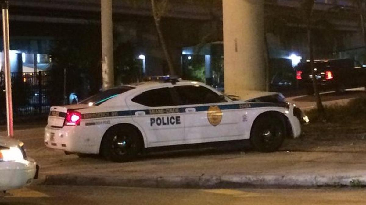 A Miami-Dade police car was hit by a Mercedes in a hit-and-run crash Wednesday morning in downtown Miami.
