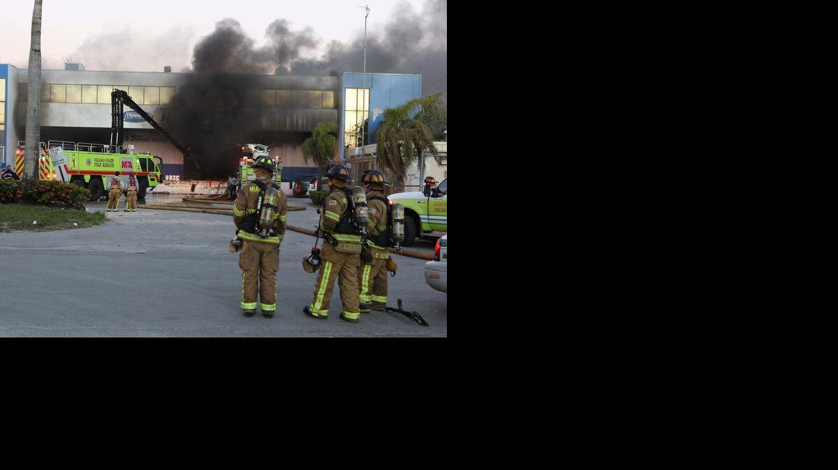 
Miami-Dade Fire Rescue respond to a fire that broke out at a cargo warehouse at 2205 NW 70th Ave. near Miami International Airport Wednesday, Dec. 10, 2014.
