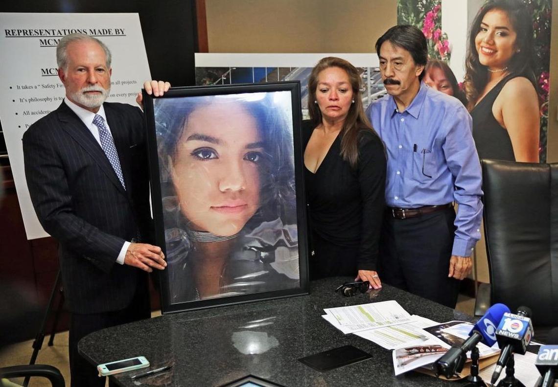 Gina and Orlando Duran, parents of Alexa Duran, who died when the FIU pedestrian bridge collapsed, along with their lawyer, Alan Goldfarb, left, stand with a portrait of their daughter during a news conference Tuesday.