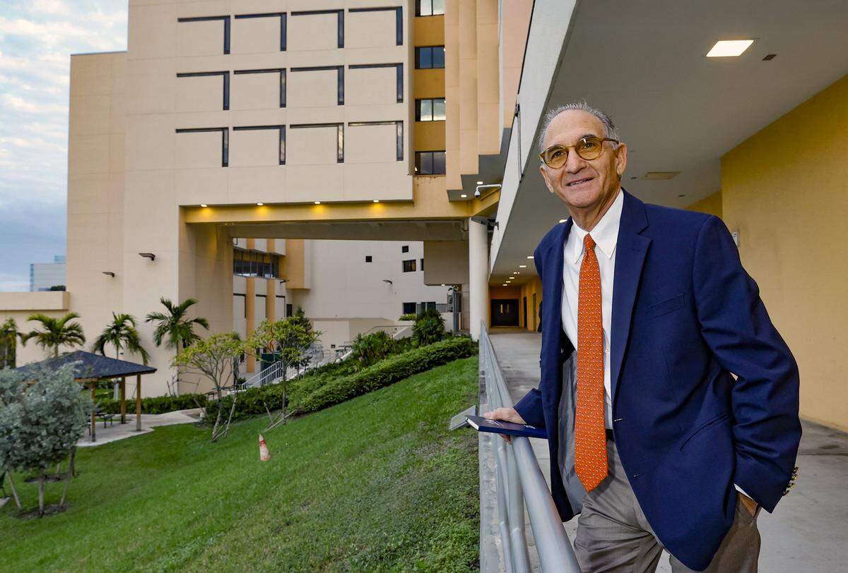 Retired Miami-Dade County criminal court Judge Steve Leifman presided over construction of the Miami Center for Mental Health and Recovery, but will Miami-Dade County Commissioners vote for the agreement needed for the center to open? Commissioners are scheduled to vote on the operating agreement on Tuesday, Dec. 16, 2025, with some board members raising concerns about costs. In this photo taken Jan. 14, 2025, Leifman poses outside the still-vacant facility.