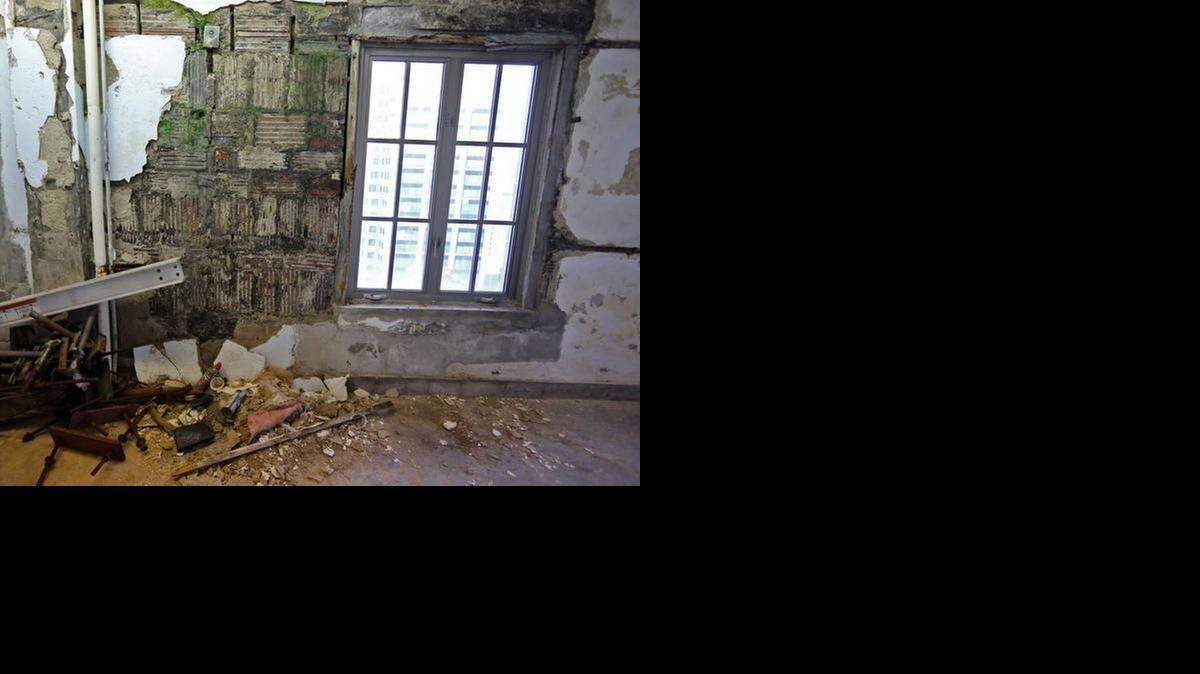 
Green mold can be seen growing on the walls of the top floor of the historic Dade County Courthouse.
