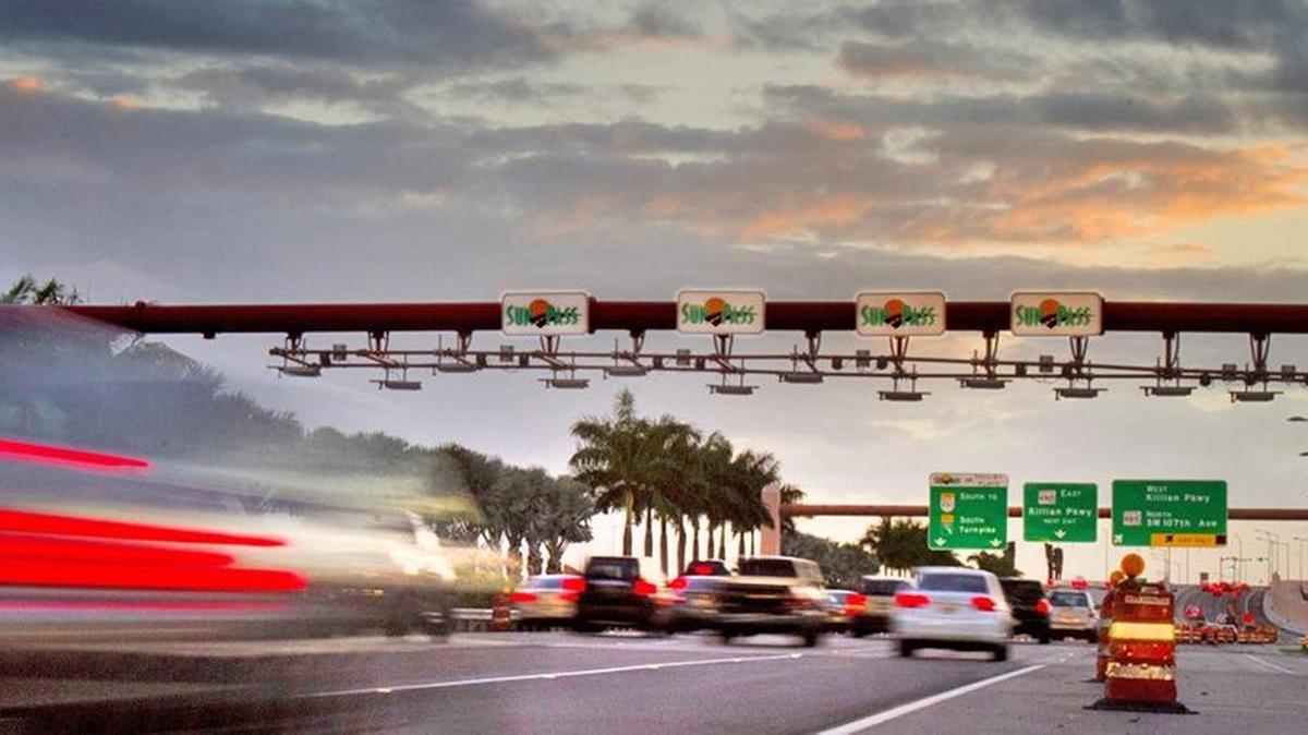 Evening rush hour traffic heads through the SunPass/toll-by-Plate area near Killian Parkway near the Turnpike extension.