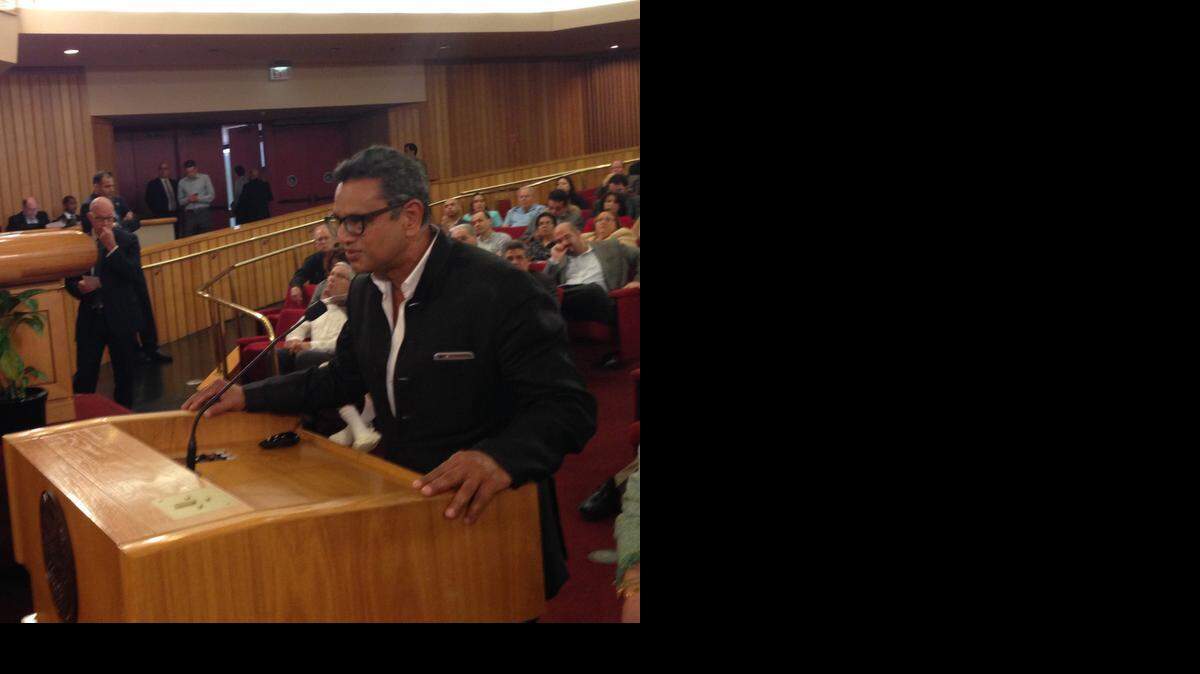 
New York fashion designer Naeem Khan addresses Miami-Dade commissioners in pursuit of a land deal for a new Miami dress-making facility. Commissioners approved a discounted lease deal for Khan on county land.

