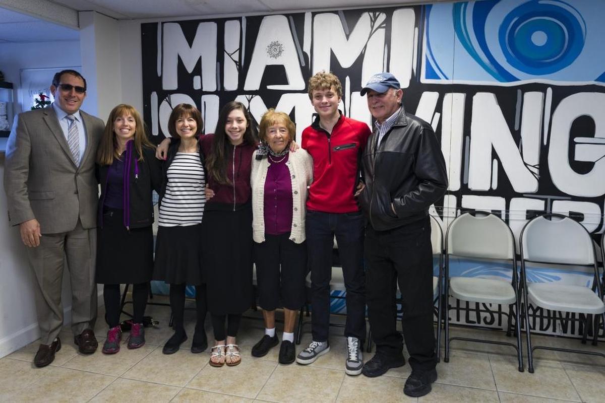 The Eisenmann Family poses on Dec. 13, 2017, for a photo before 85-year old Holocaust survivor Henriette Siebenberg, third from right, skydives with her grandson, Shmuel Eisenmann, second from right, to celebrate his birthday.