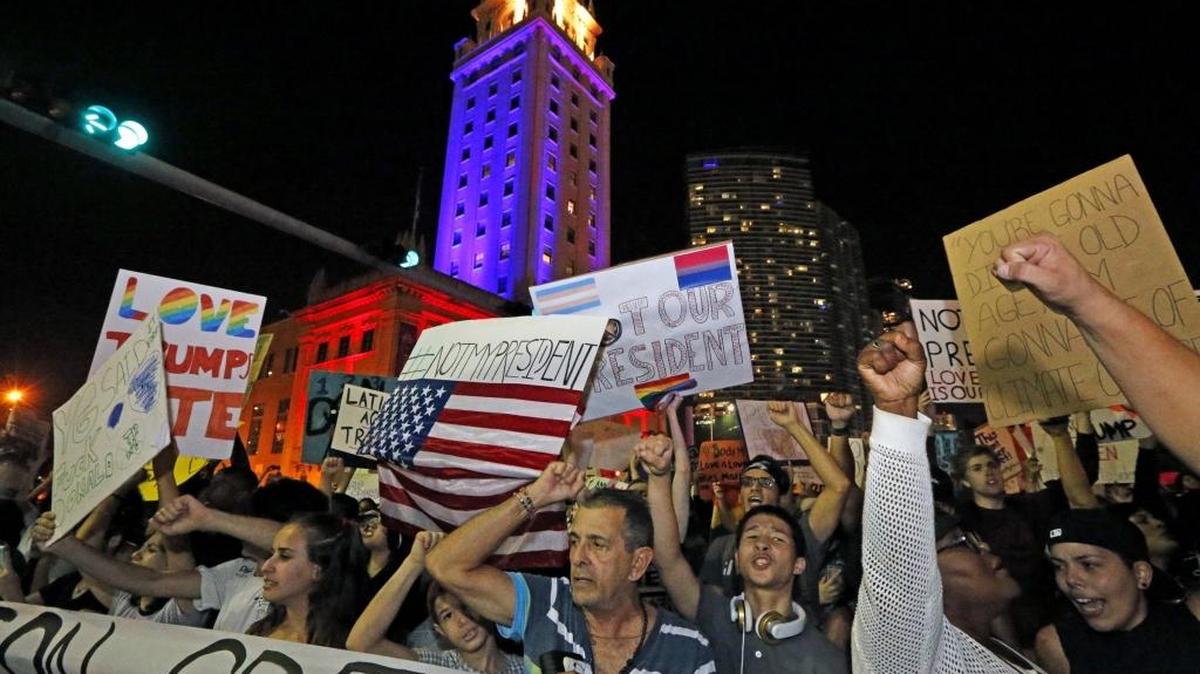 Demonstrators march along Biscayne Boulevard in protest against President-elect Donald Trump on Nov. 11.