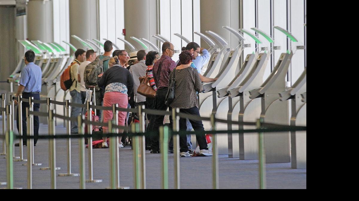 
International travelers use the Automated Passport Control-(APC), for US citizens and permanent residents used for re-entry in to the United States on Friday May 8, 2015.
