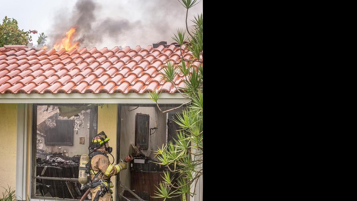 
Miami-Dade Fire Rescue worked to put out a house fire in Southwest Dade Tuesday, which may have been caused by lightning, firefighters said.
