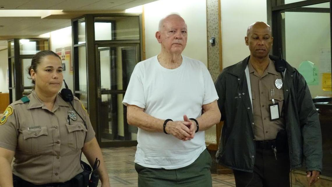 Miami-Dade police take lawyer Guy Bailey, 79, into custody after a judge sentenced him Tuesday to 25 months in state prison for stealing $700,000 from his clients.