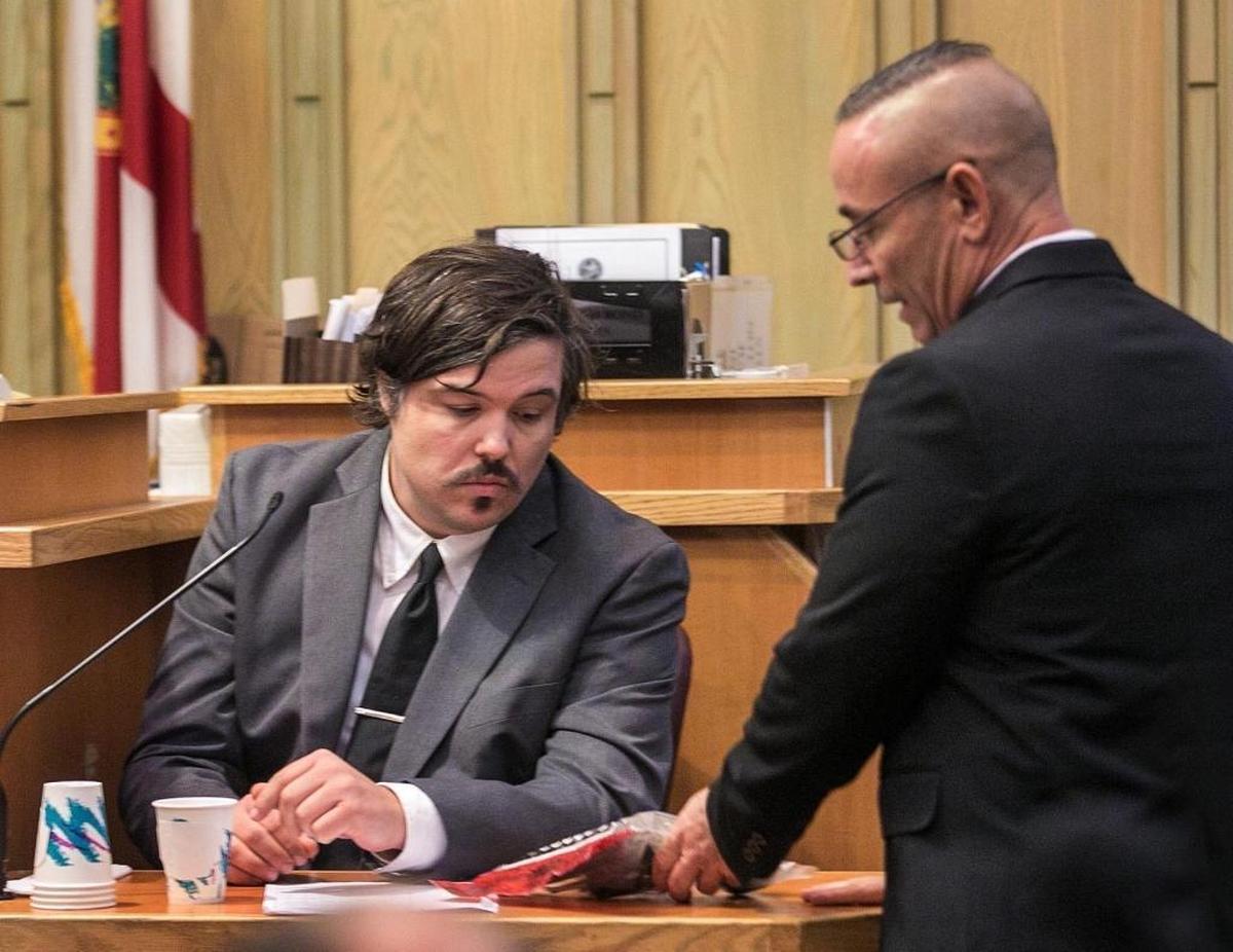Ryan Grandy, roommate of murdered Louis Salgar. confirms to prosecuting attorney Scott Warfman the Taurus 357 caliber revolver that he owned and was used in the murder of Louis Salgar on opening day of murder trial on Thursday, Nov. 2, 2017