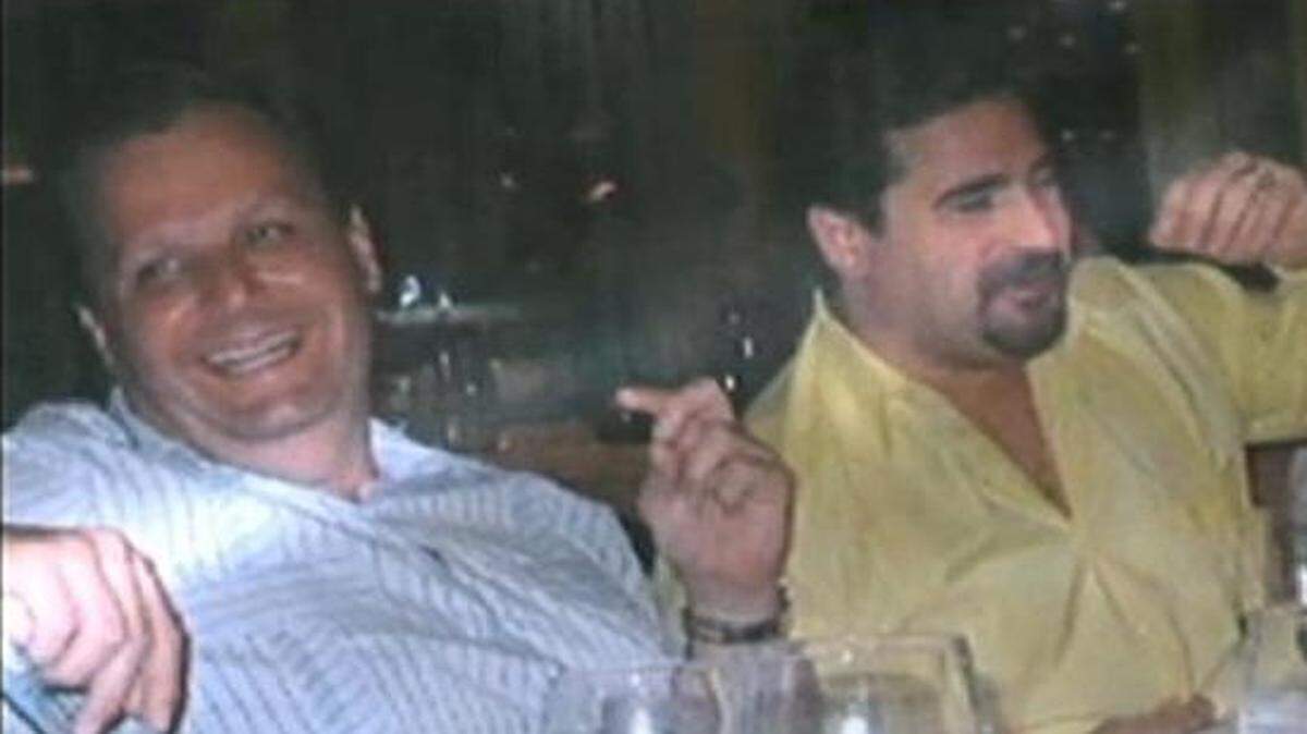 
Socializing: Former mayor Julio Robaina, left, was acquitted of his involvement in Luis Felipe Perez’s investment scheme. 
