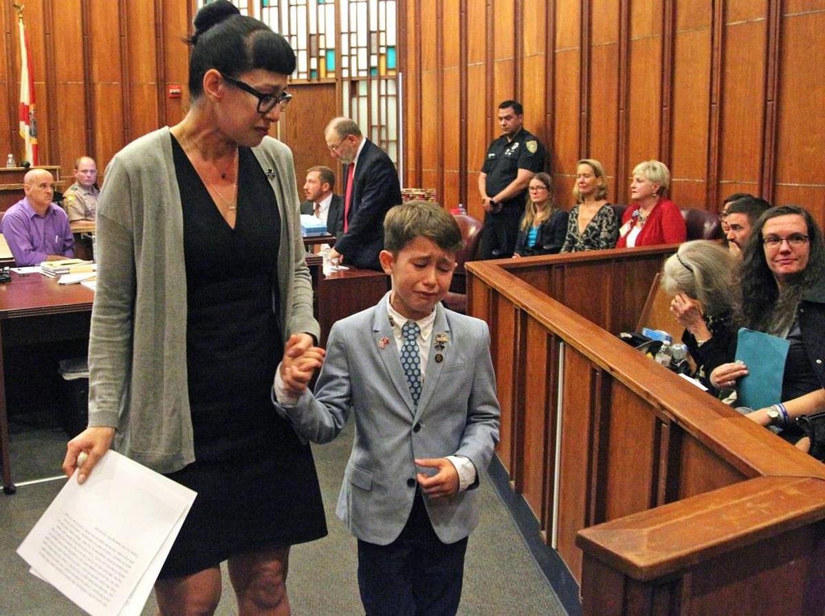 Suzy Rivera, left, and her son, Patrick Mcguire, 7, right, walk hand-in-hand after they testified about their loss due to Scott McGuire's death, their husband and father, respectively, on Wednesday, Nov. 29, 2107. Jordana Rosales, a former FIU student, was sentenced Wednesday to seven years in prison for the drunken hit-and-run crash that claimed the life of McGuire, a veteran U.S. Homeland Security Investigations agent. She’ll also have to serve five years of probation.