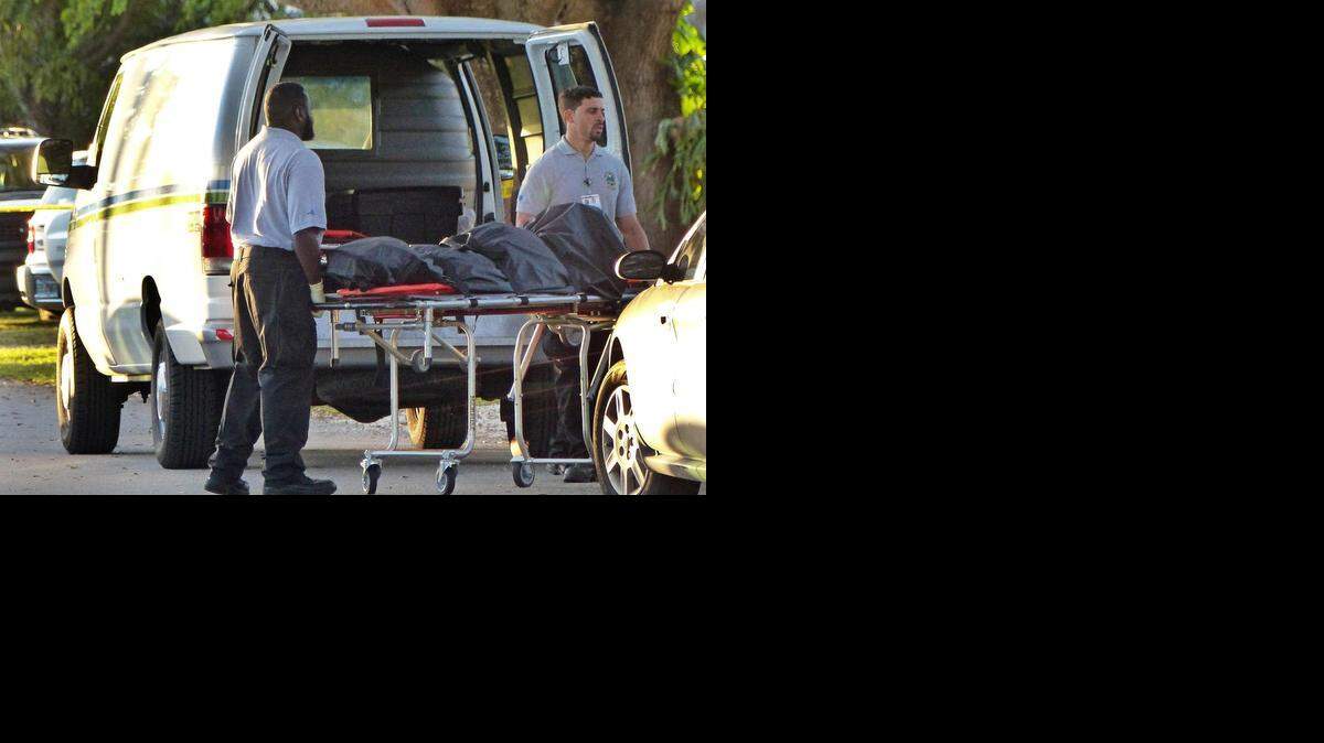 
Miami Dade County Homicide Crime Scene place one of the two bodies into a van from a home in the 800 Block of Swan Avenue in Miami Springs on Saturday, Dec. 6, 2014, where two elderly persons were found dead in what seems to be an alleged murder/suicide.
