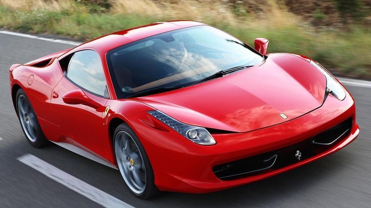A red Ferrari is shown in this stock image.