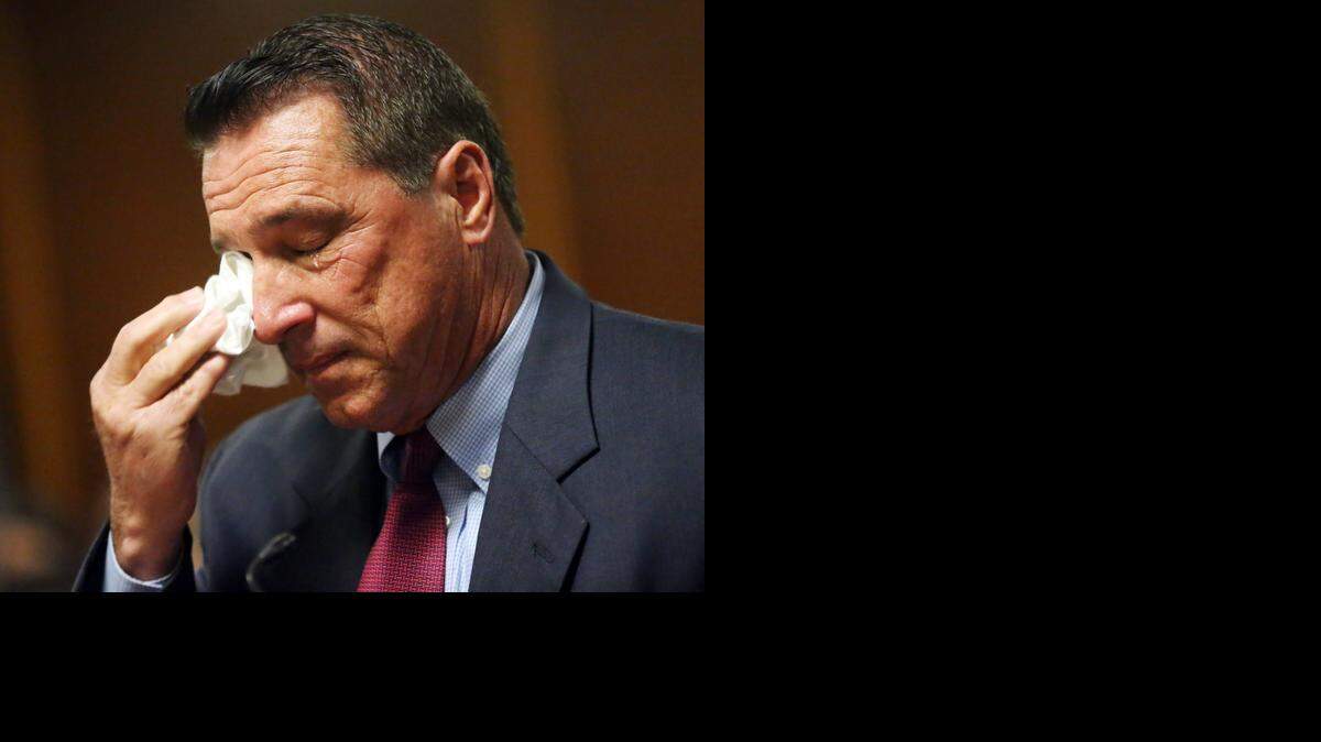 
Ex-Homestead Mayor Steven Bateman wipes away tears after Judge Robert Luck sentenced him to 22 months in state prison on Friday, Dec. 19,2014.
