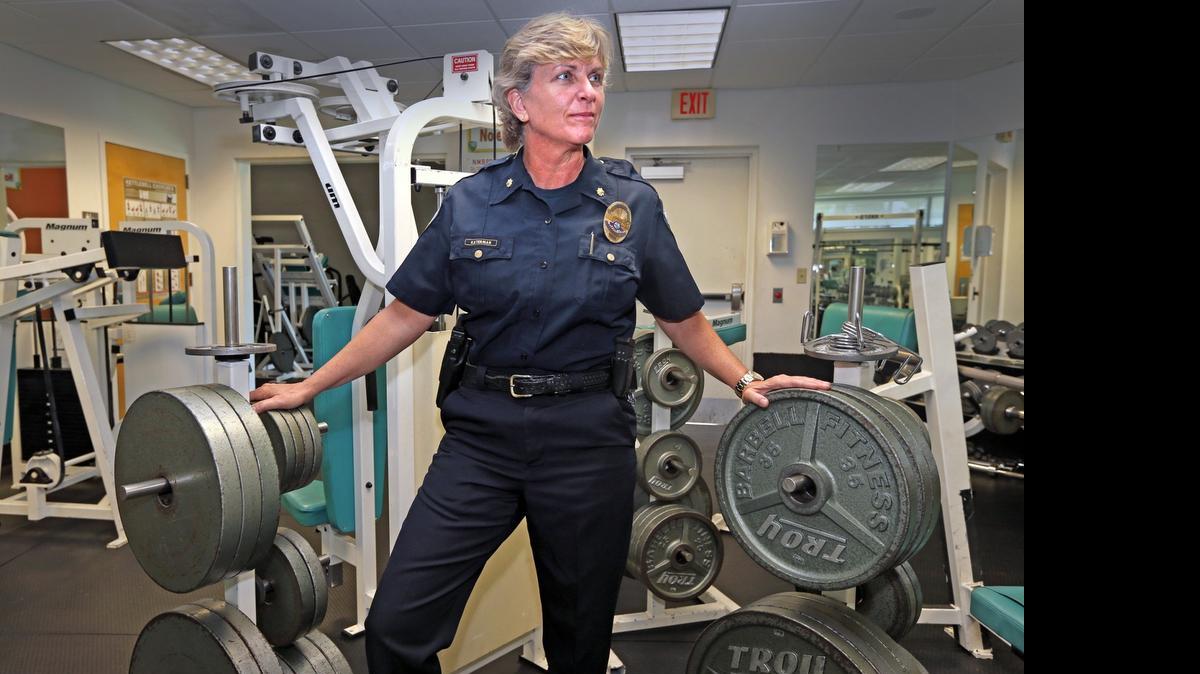 
UNDETERRED: Maj. Kathy Katerman in the fitness room at the North Miami Beach Police Department. Katerman is one of North Miami Beach’s highest ranking officers in the department.
