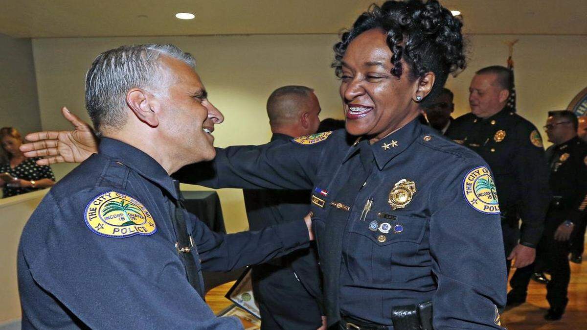 
Anita M. Najiy, Assistant Chief of Police, City of Miami Police congratulates Jorge R. Colina as Assistant Chief of Police during the promotions of seven executive staff members for the City of Miami Police on Friday, April 17, 2015.
