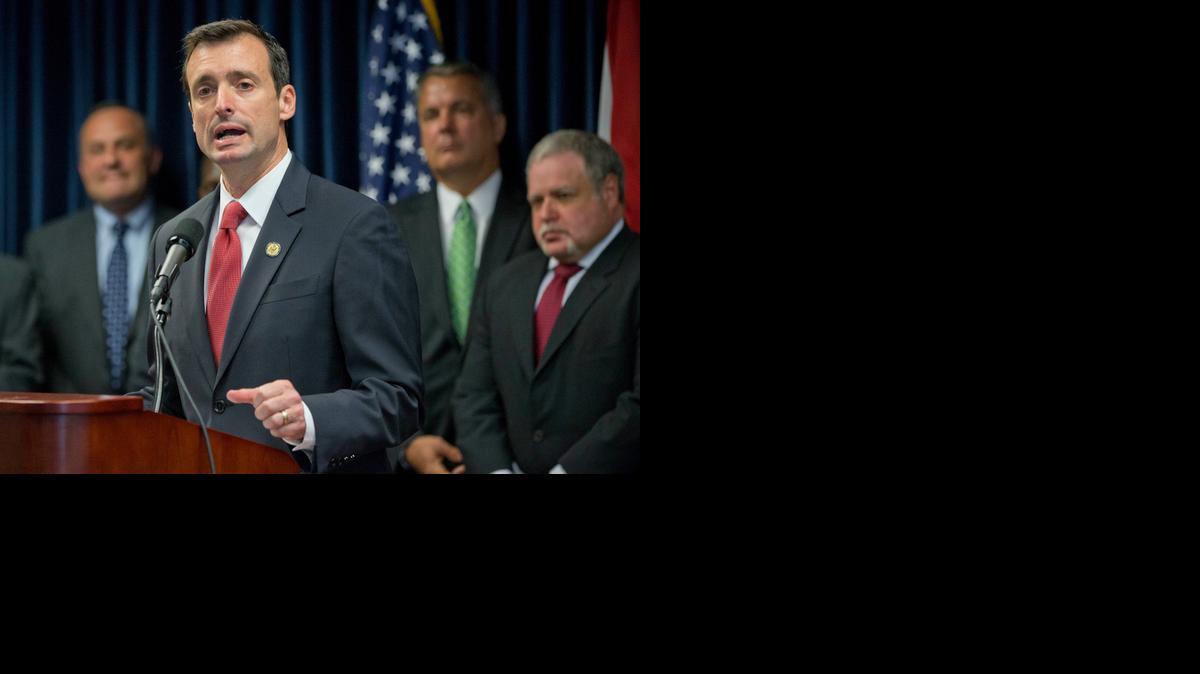 
U.S. Attorney for the Southern District of Florida, Wifredo Ferrer, foreground, gestures as he speaks during a news conference announcing the results of an operation by the South Florida Identity Theft Tax Fraud Strike Force, against identity theft refund schemes, Thursday, April 9, 2015, in Miami. Federal investigators say 42 people in South Florida have been charged with identity theft and fraud that involved intended losses of $21 million.
