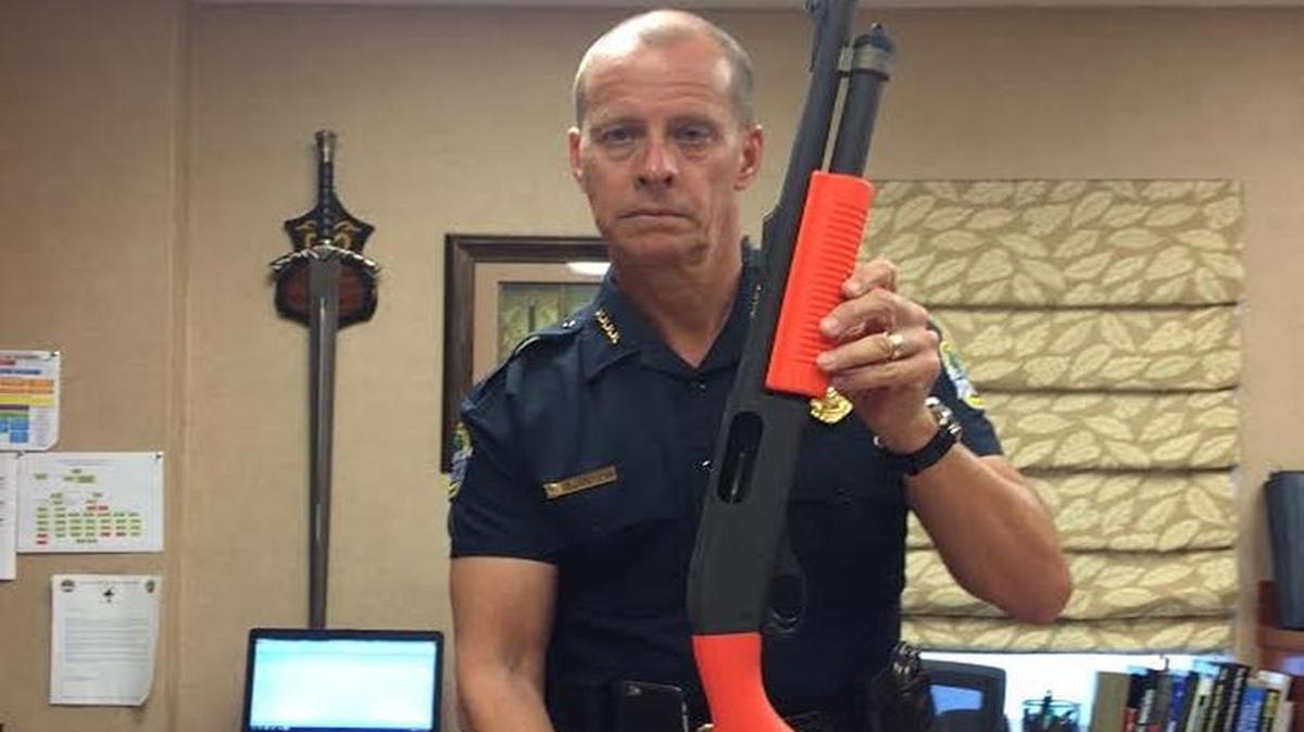 Bal Harbour Police Chief Mark Overtown shows off the new converted shotguns