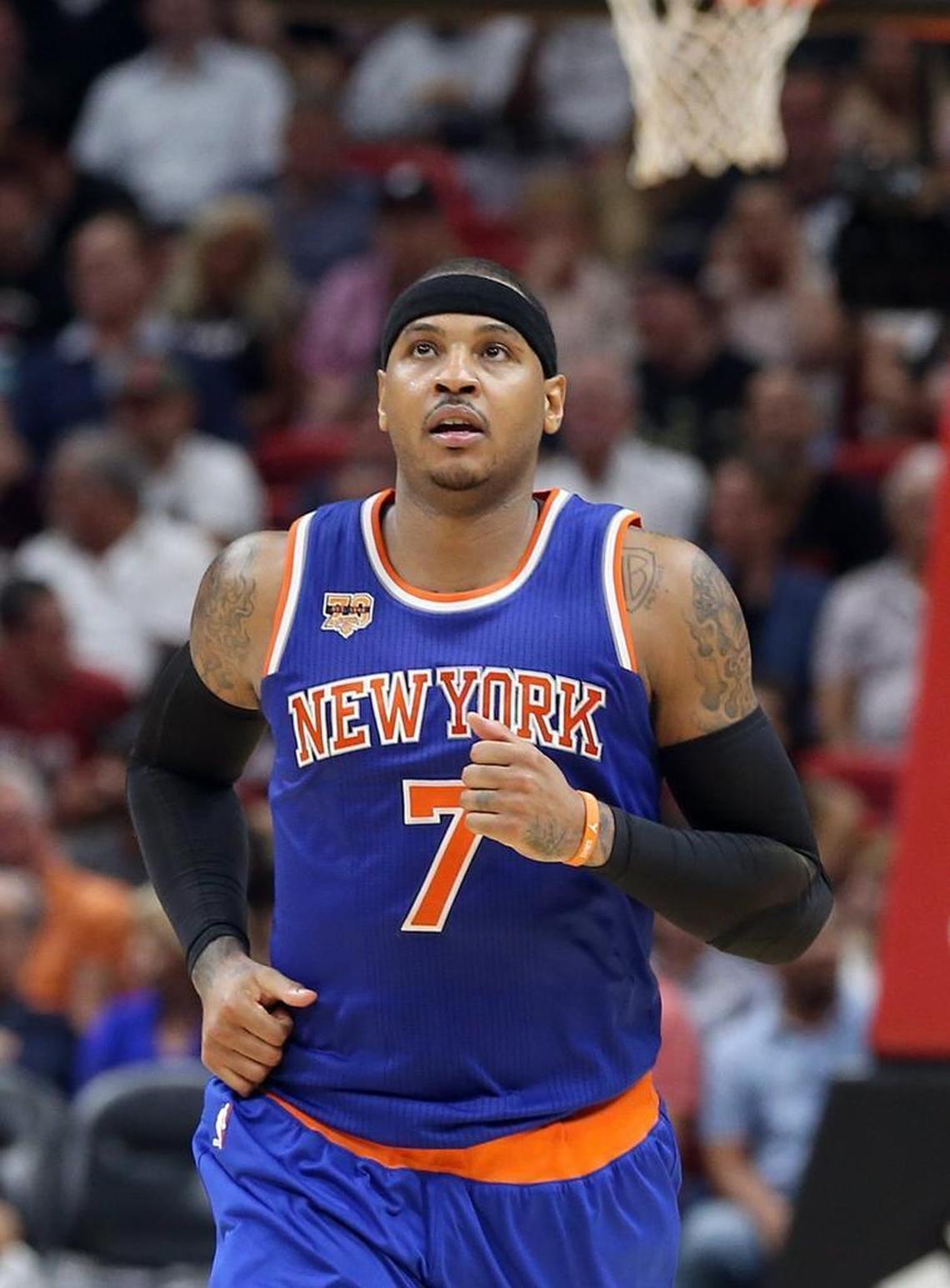 Miami Heat Knicks' forward Carmelo Anthony was targeted by a conman posing as the manager for singer Adele, police say.