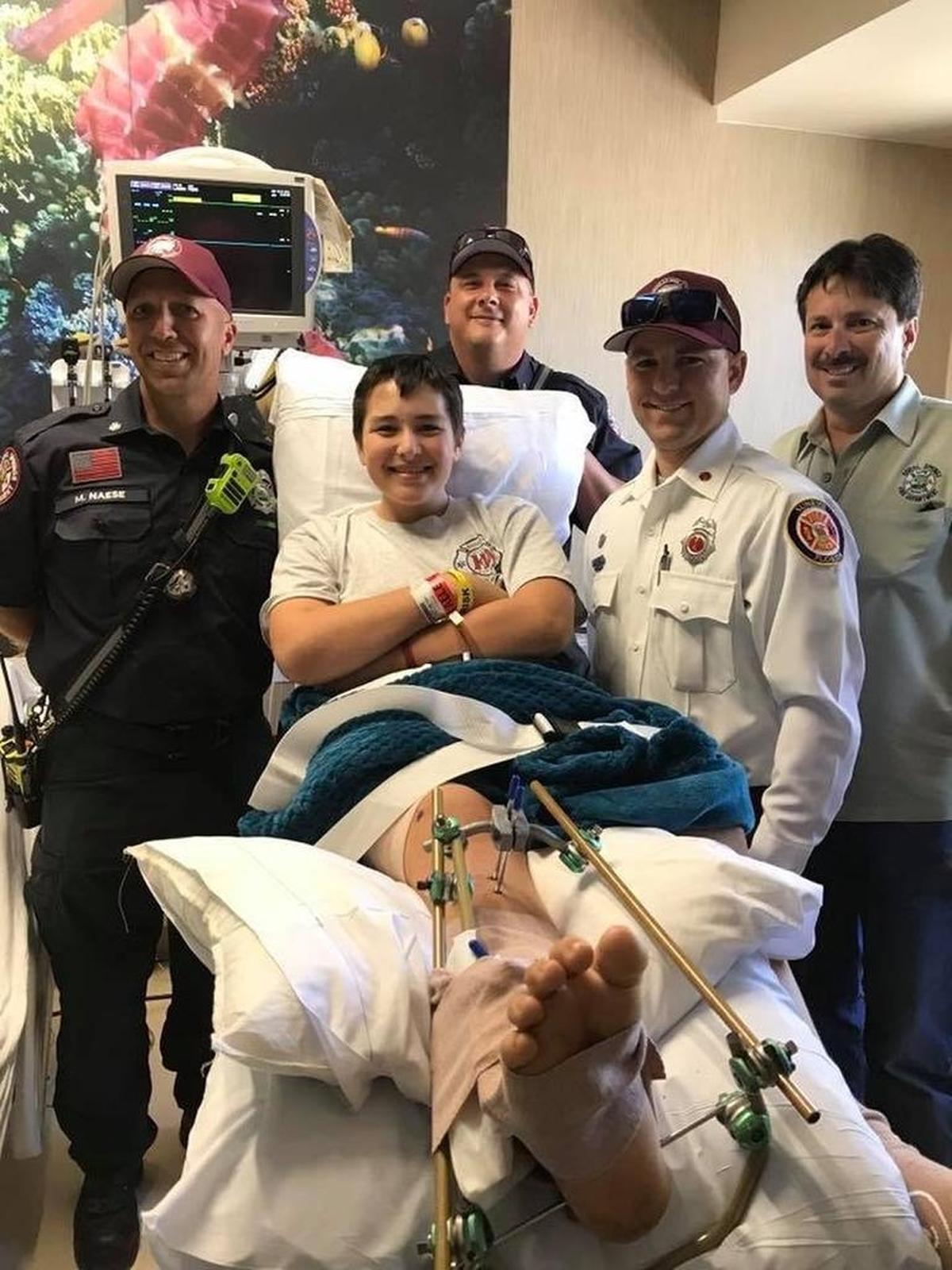 Parkland shooting victim Kyle Laman pictured here with members of Sunrise Fire Rescue following last month’s school shooting that left 17 dead and over a dozen injured.
