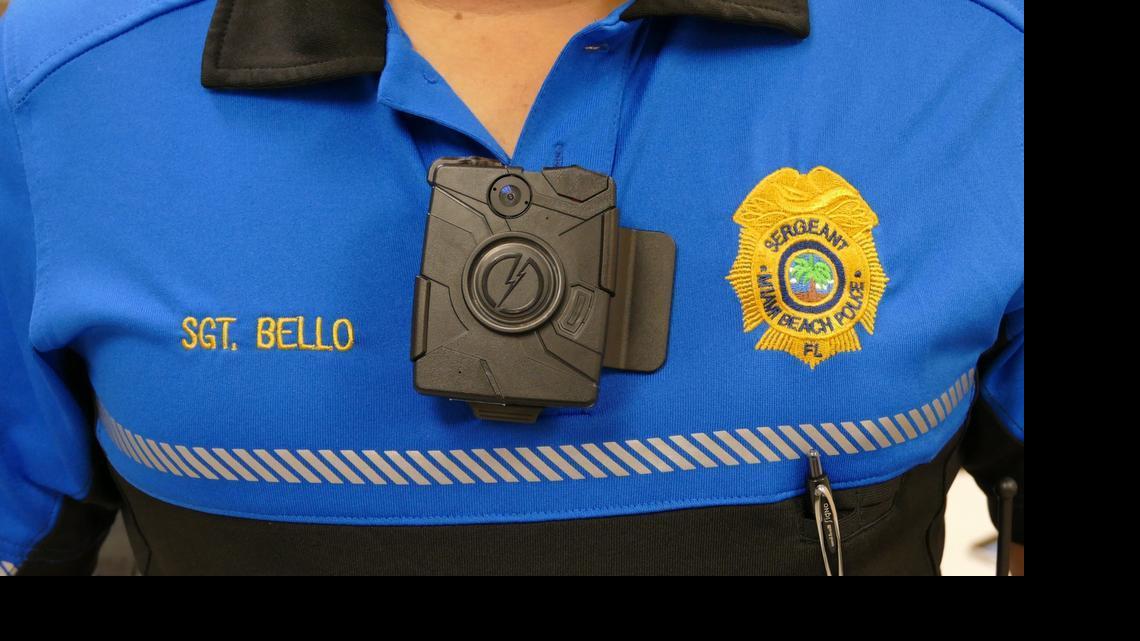 
Miami Beach Police Sgt. Alex Bello shows a body camera for officers to use on patrol.
