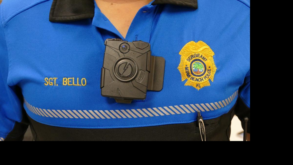 
Miami Beach Police Sgt. Alex Bello shows a body camera for officers to use on patrol.
