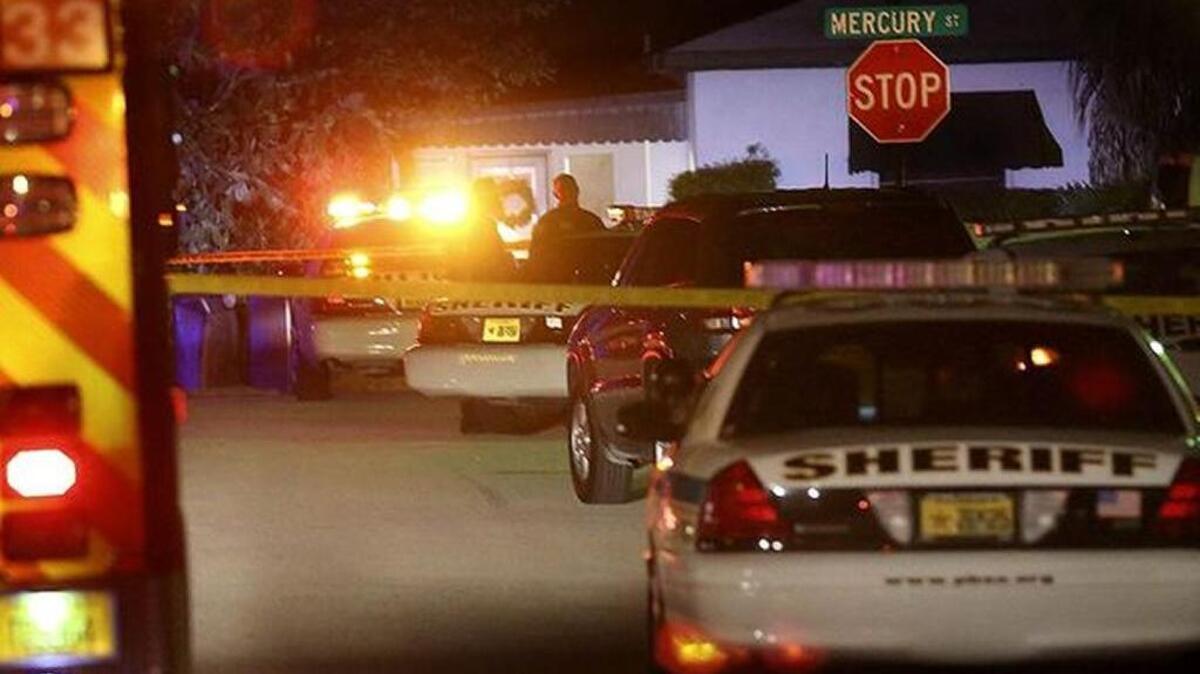 
Palm Beach County sheriff's deputies converge on the scene of a machete attack late Wednesday.
