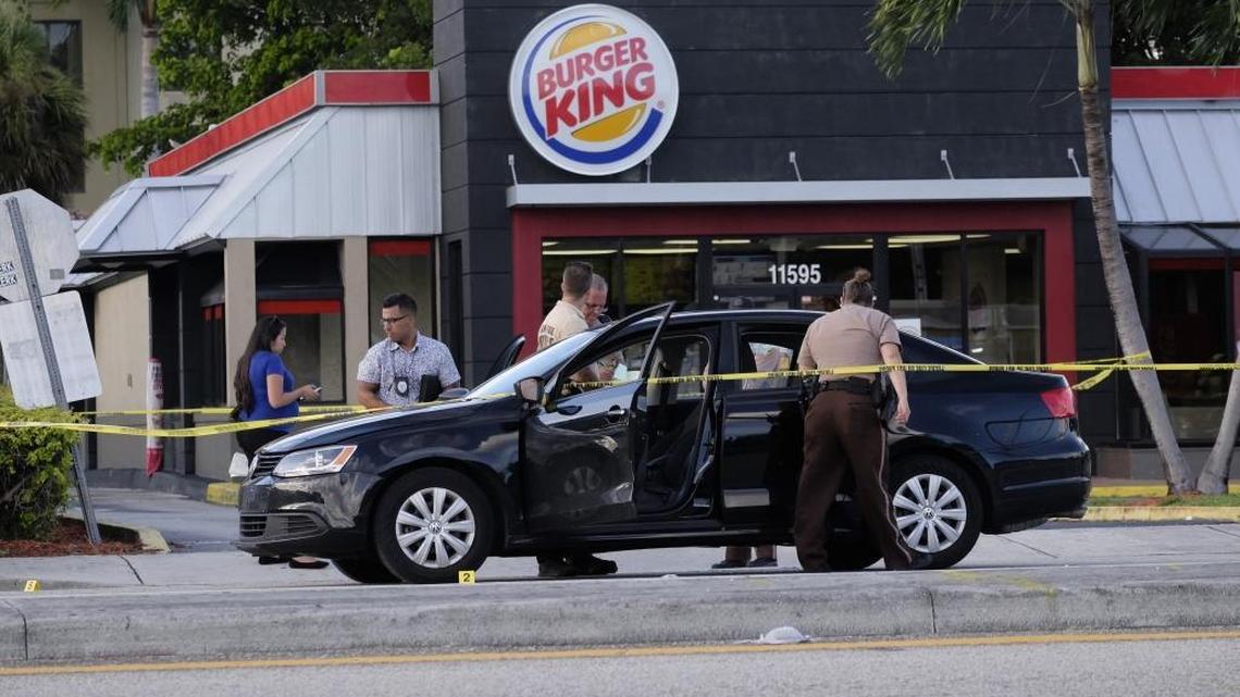 Miami-Dade police arrested two men Tuesday after a gunfight erupted when they harassed workers at a Kendall Burger King and tried to videotape the incident.