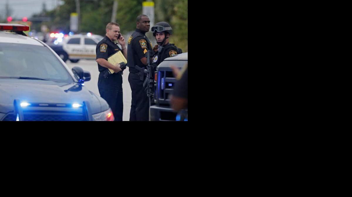
Miami Gardens police work the scene of a shooting at Northwest 33rd Court and 187th Street in Miami Gardens on Thursday, Nov. 20, 2014 where two teenagers were shot near Carol City High School.
