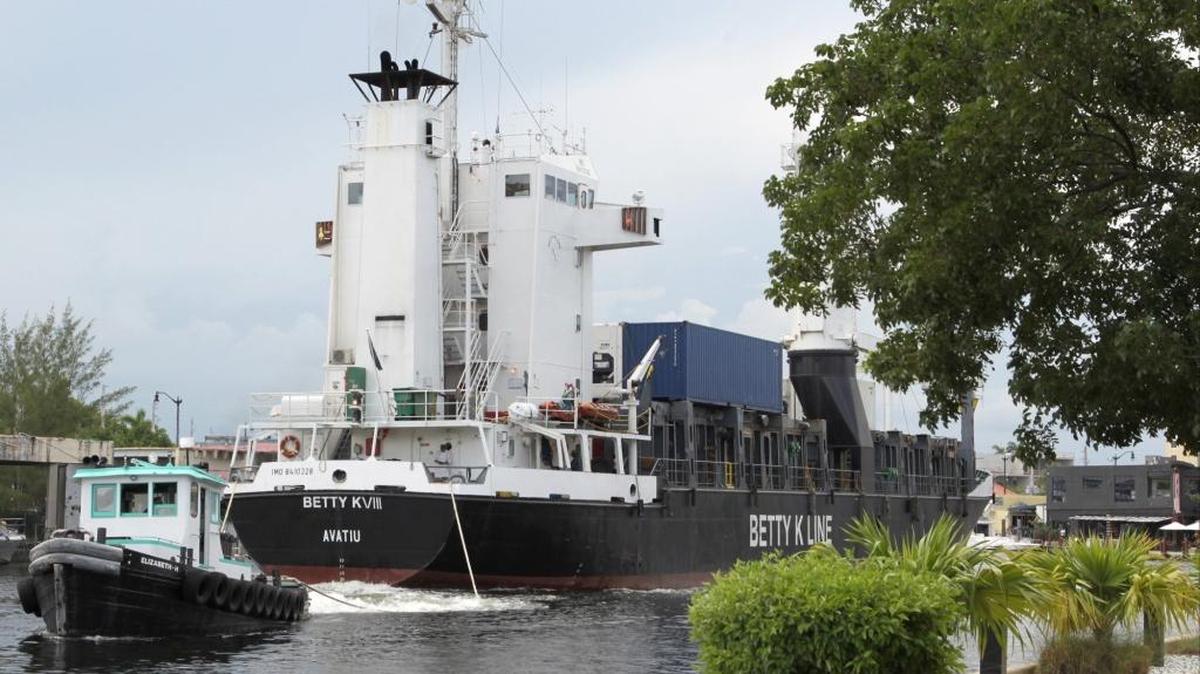 
A freighter is pulled through the Miami River. Another boat that recently docked at a shipping yard on the river after a journey from Haiti was part of a broader drug-smuggling operation, authorities say.
