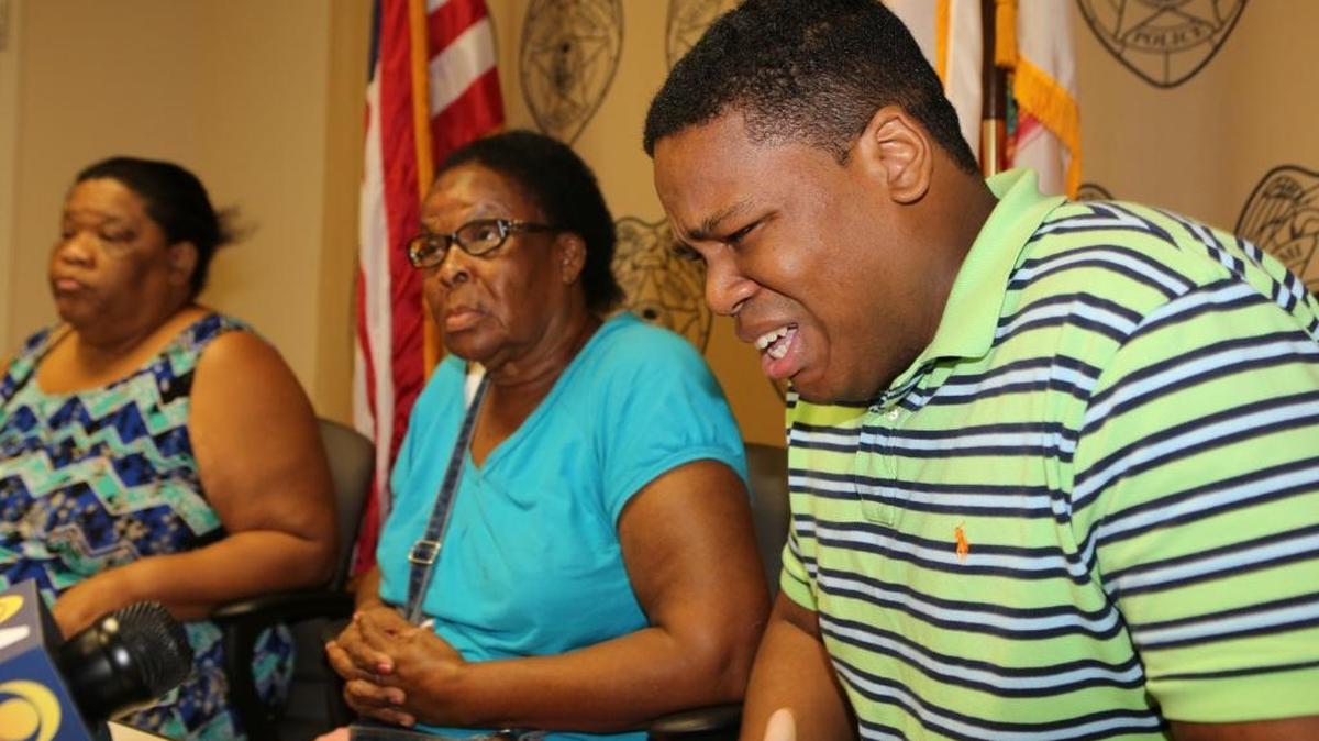 Ronald Page, brother of Evan Antwan Page, reacts during a press conference at the Miami-Dade Police Headquarters in Doral on Thursday, Nov. 12, 2015. Evan Page was fatally shot on the night of November 29, 2005 and on Thursday, his family asked the public to help find Evan’s killer. With him are his grandmother Luela Page, center, and his mother, Rhonda Page.