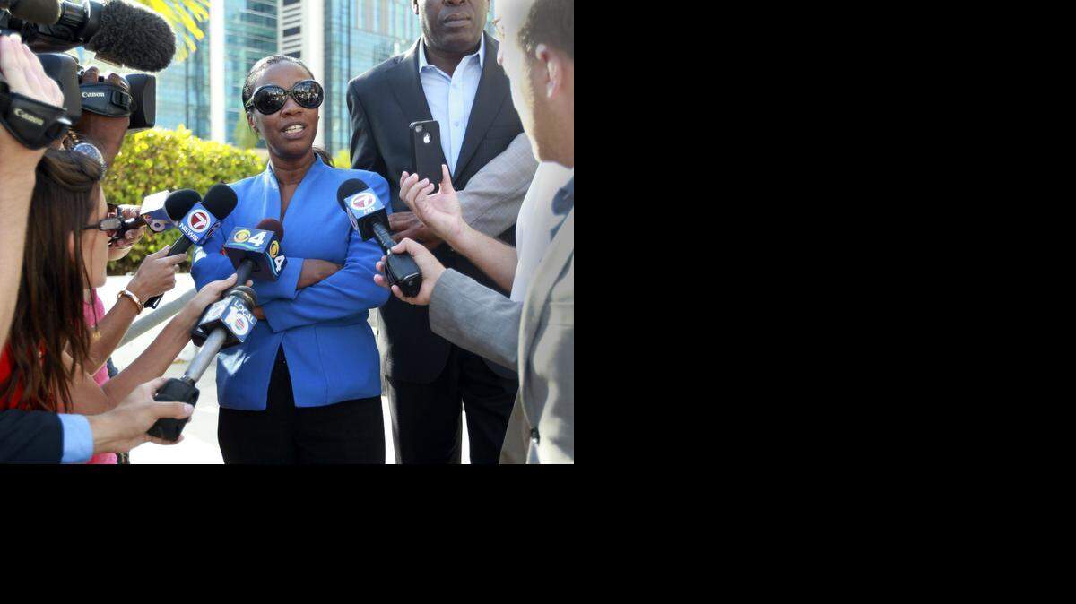 
In May, North Miami Mayor Lucy Tondreau talks with the media outside the federal courthouse in Miami. Her trial on charges of mortgage fraud could end this week.
