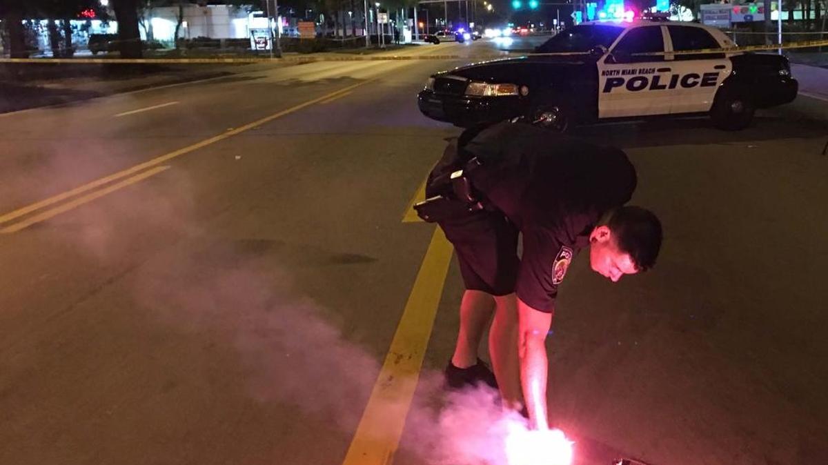 Police officer at scene of apparent shooting at NE 167th Street and NE Sixth Avenue in North Miami Beach on Saturday, April 2.