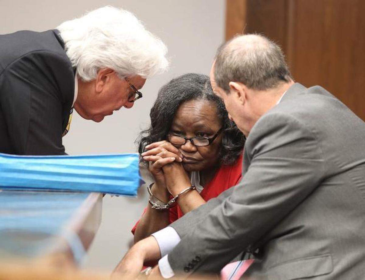 Geralyn Graham talks to attorneys Michael Matters, left, and Scott Sakin before Miami-Dade Circuit Judge Marisa Tinkler Mendez. This was prior to the reading of Graham’s sentencing. She was convicted February 12, 2013, in the abuse and kidnapping of foster child Rilya Wilson.