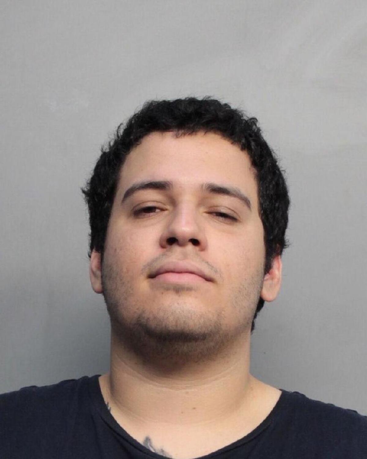 Enrique Santana, 26, was charged with attempted murder and aggravated battery after a standoff at a Kendall Burger King in which police said he and a friend tried to videotape themselves harassing employees.
