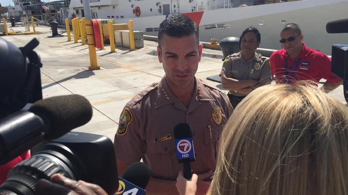 Miami-Dade Police Director Juan Perez speaks to reporters with the Coast Guard Cutter Bernard Webber behind him Saturday, Feb. 6, 2015 in a break from a day-long anti-terror exercise carried out around the county. Nearly two dozen law enforcement agencies took part.