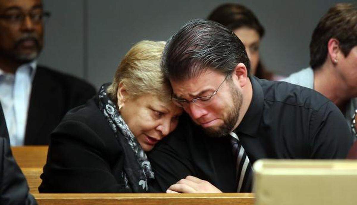 Luisa Moya, 63, comforts, Rene Azcarreta, 35, as he breaks down in court while the details of his mother's 1987 murder are discussed last week in Miami-Dade Court. Azcarreta was just seven years old when he found his mother, Linda Azcarreta, 32, stabbed to death in her Miami home. Linda was killed by her friend, Rafael Andres. The death penalty phase for a second murder committed by Rafael Andres, who is convicted of murdering waitress, Yvette Fariñas, in 2005 is taking place in Judge Dava Tunis' courtroom. Luisa Moya is the mother of Yvette, Andres second murder victim.