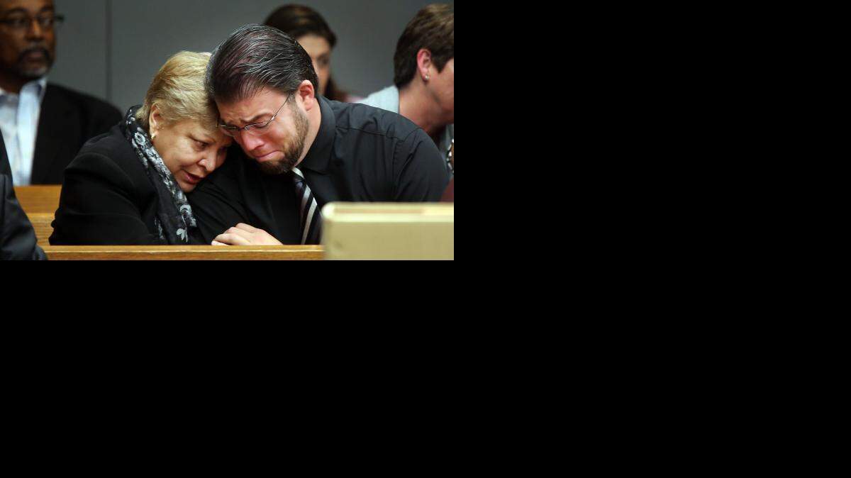 
Luisa Moya, 63, comforts, Rene Azcarreta, 35, as he breaks down in court while the details of his mother's 1987 murder are discussed last week in Miami-Dade Court. Azcarreta was just seven years old when he found his mother, Linda Azcarreta, 32, stabbed to death in her Miami home. Linda was killed by her friend, Rafael Andres. The death penalty phase for a second murder committed by Rafael Andres, who is convicted of murdering waitress, Yvette Fariñas, in 2005 is taking place in Judge Dava Tunis' courtroom. Luisa Moya is the mother of Yvette, Andres second murder victim.
