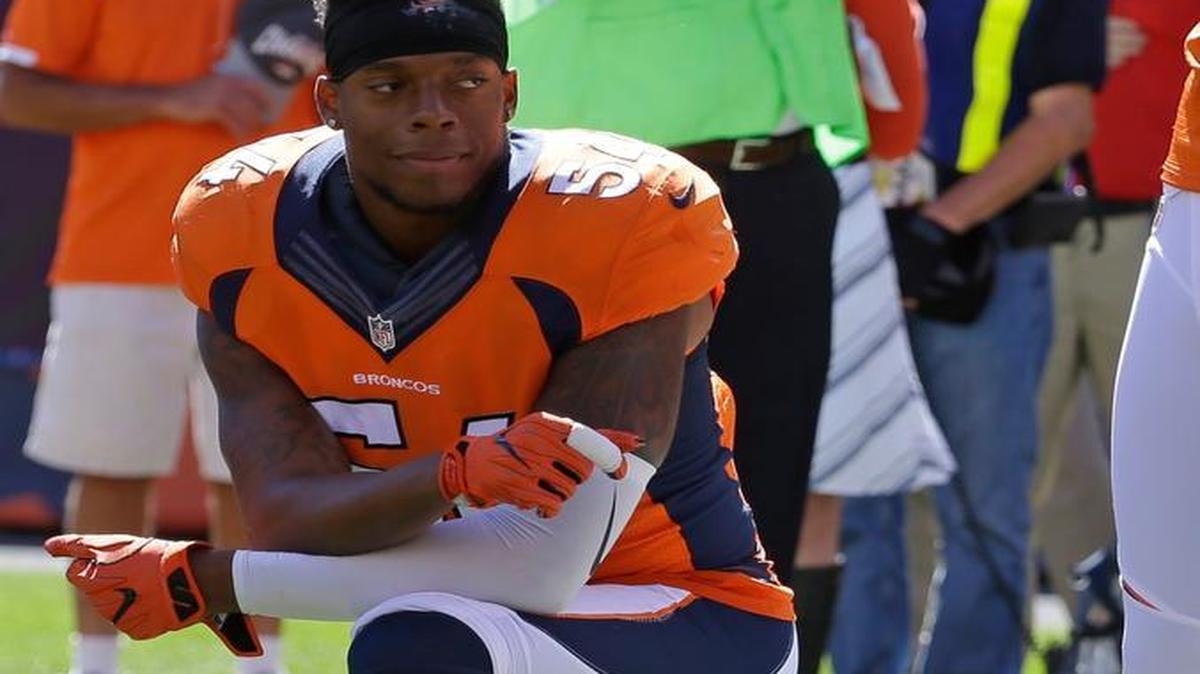 Denver Broncos inside linebacker Brandon Marshall takes a knee during the National Anthem in first half of a NFL football game against the Indianapolis Colts, Sunday, Sept. 18, 2016, in Denver.