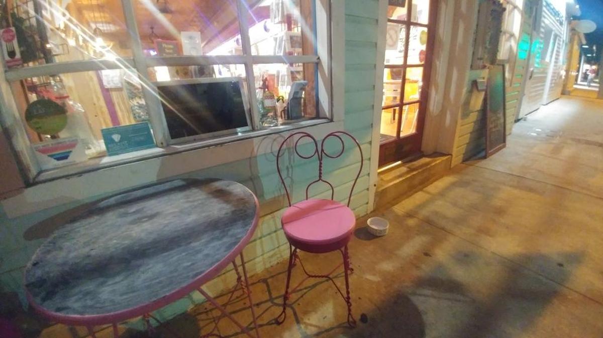 A diner employee hurled this pink chair at the robber as he pedaled past on his bicycle.
